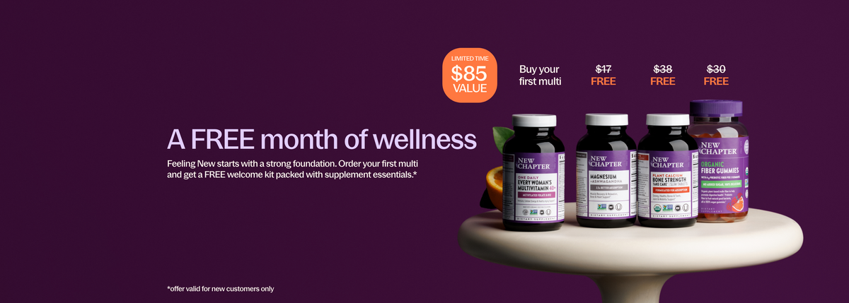 Promotional banner for Vitality Wellness showing four supplement bottles on a white pedestal against a dark purple background, with text offering a free month of wellness and price callouts.